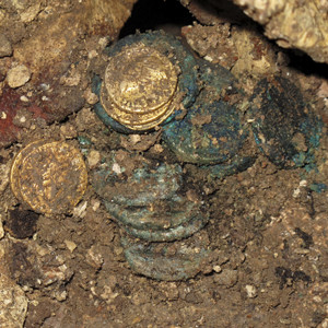 Hoard of gold, silver and bronze Roman coins mixed with two Bar Kokhba denarii, struck between 132-136 CE. Te’omim Cave, Israel.  © photo B. Langford and B. Zissu  (Journal of Jewish Studies 52, 2, pp. 262-83)